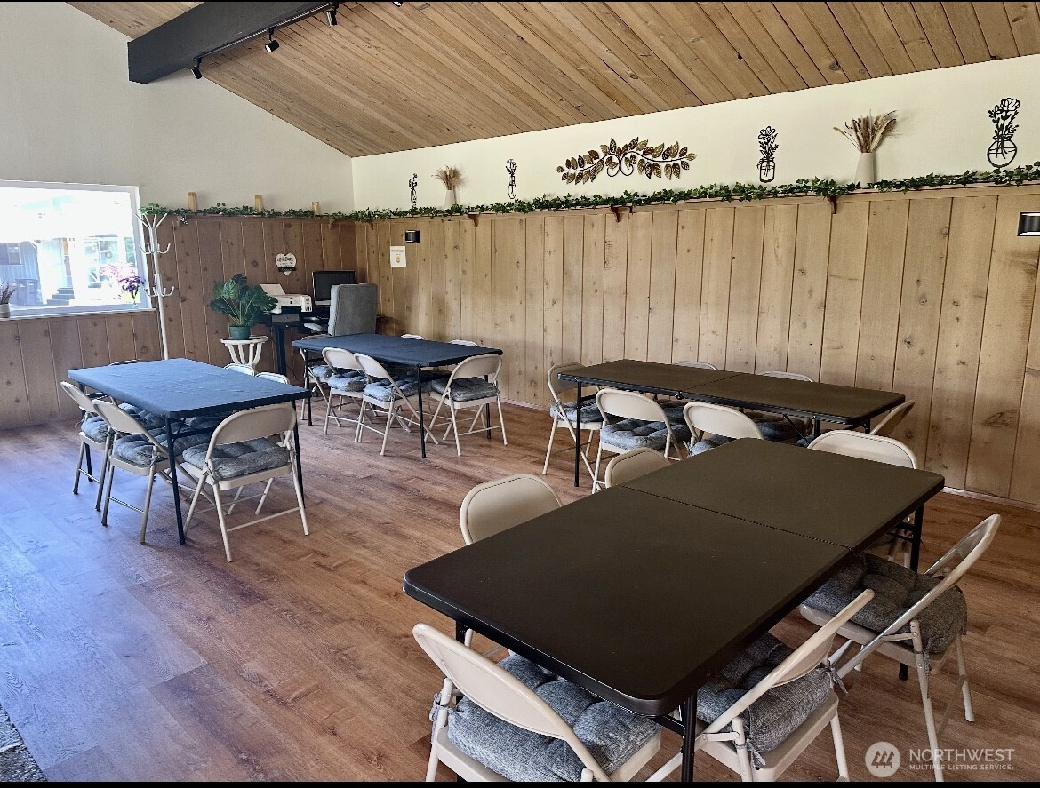 18501 52nd Avenue West, Unit 84 Lynnwood, WA 98037 - Photo 27 of 32 a view of a dining room with furniture and wooden floor
