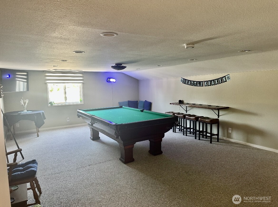 18501 52nd Avenue West, Unit 84 Lynnwood, WA 98037 - Photo 29 of 32 a living room with furniture and a table