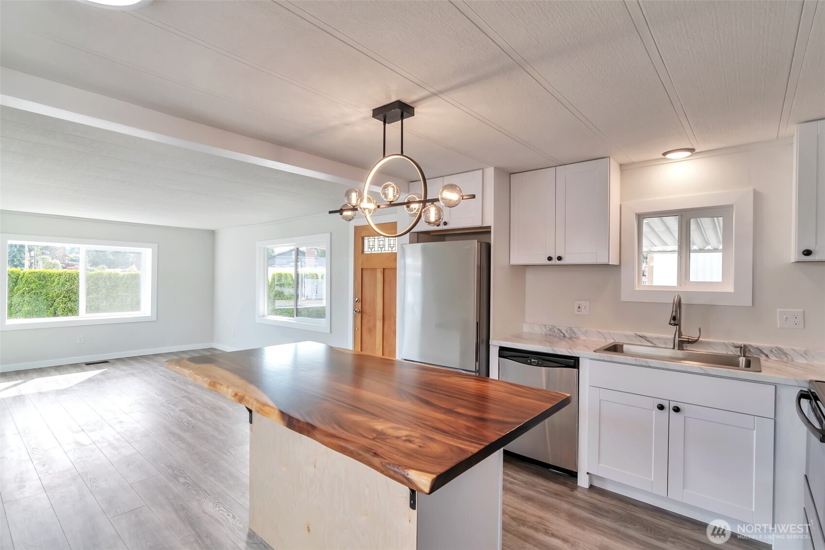 18501 52nd Avenue West, Unit 84 Lynnwood, WA 98037 - Photo 5 of 32 a kitchen with stainless steel appliances granite countertop a sink stove and refrigerator