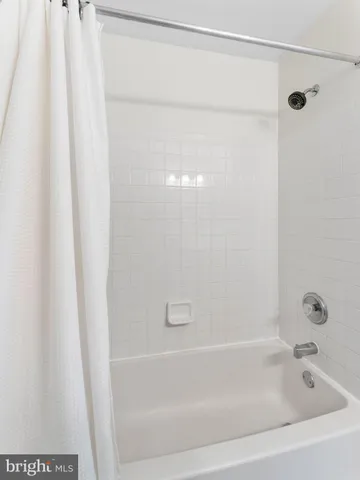 a close view of a bathtub in a bathroom