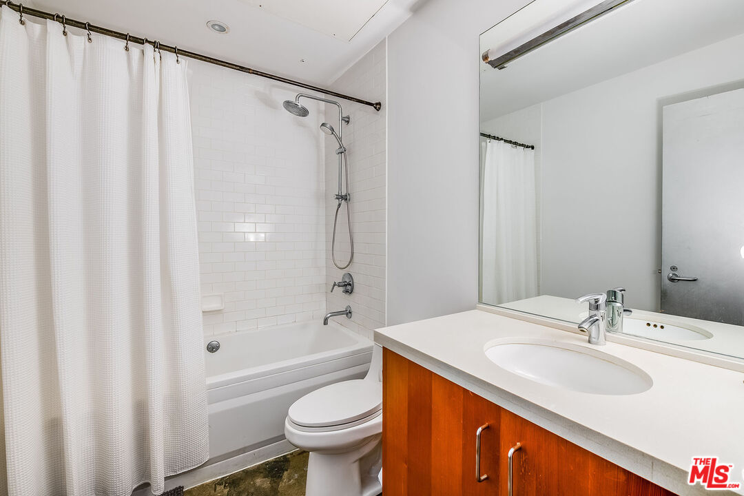 1855 Industrial Street, Unit 703 Los Angeles, CA 90021 - Photo 19 of 51 a bathroom with a sink toilet and shower