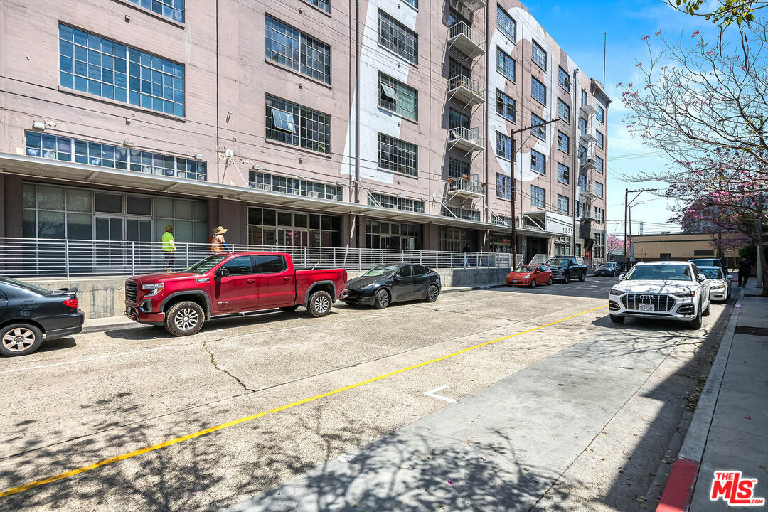1855 Industrial Street, Unit 703 Los Angeles, CA 90021 - Photo 27 of 51 a view of a cars parked in front of a building