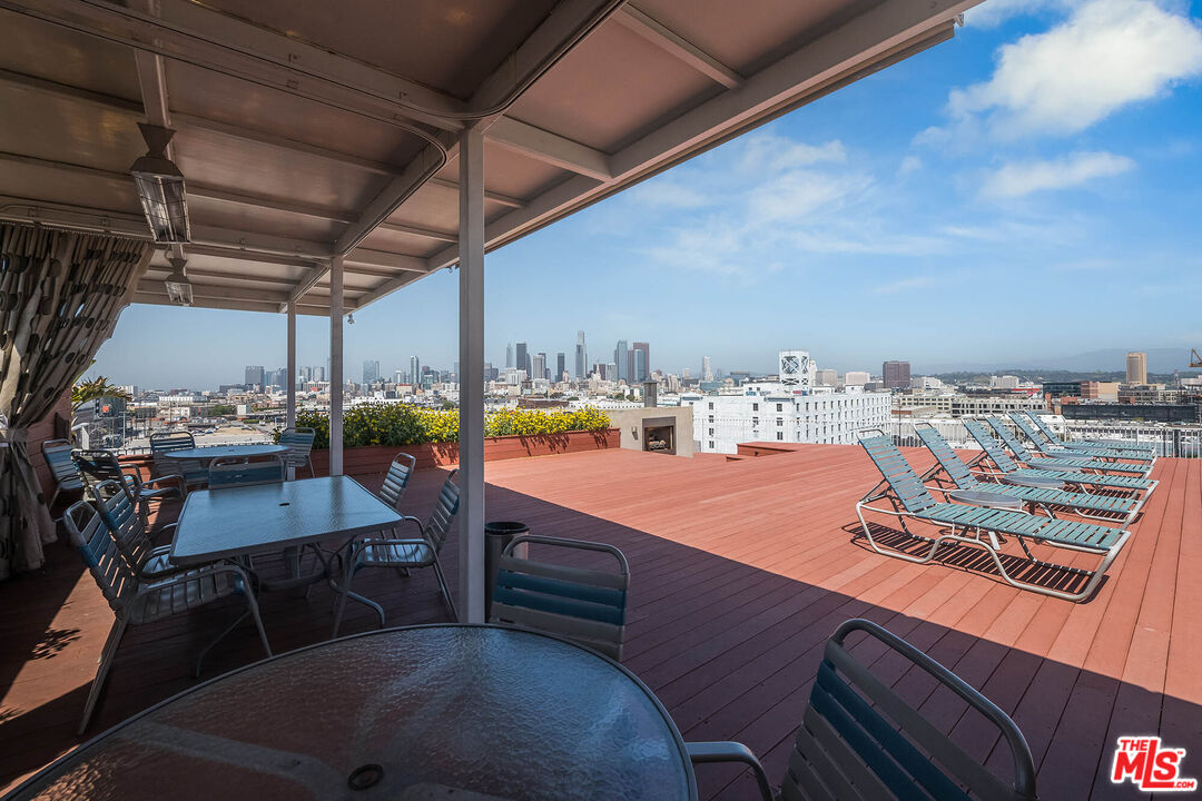 1855 Industrial Street, Unit 703 Los Angeles, CA 90021 - Photo 33 of 51 a view of a chairs and table in the balcony