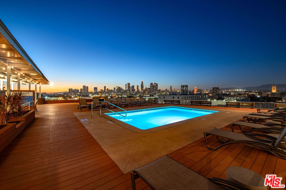 1855 Industrial Street, Unit 703 Los Angeles, CA 90021 - Photo 38 of 51 a view of a swimming pool with lawn chairs