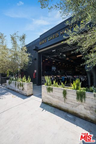 a view of a park with swings and a fire pit