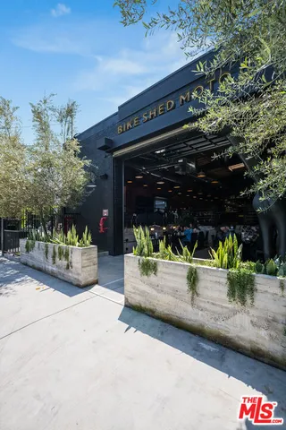a view of a park with swings and a fire pit
