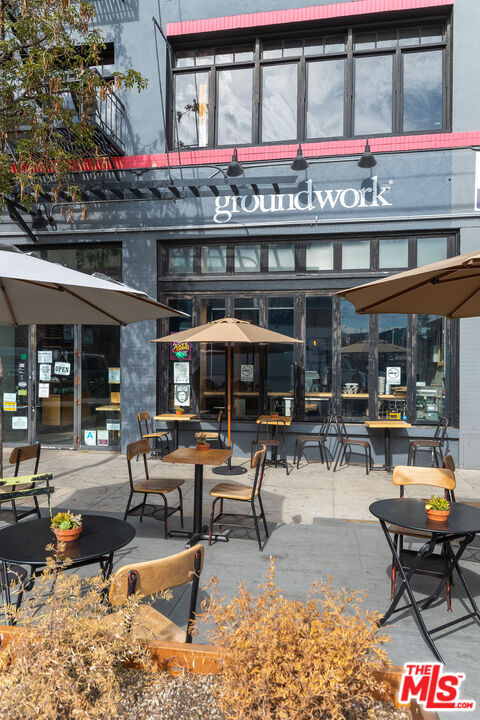 1855 Industrial Street, Unit 703 Los Angeles, CA 90021 - Photo 48 of 51 a building outdoor space with patio furniture and potted plants