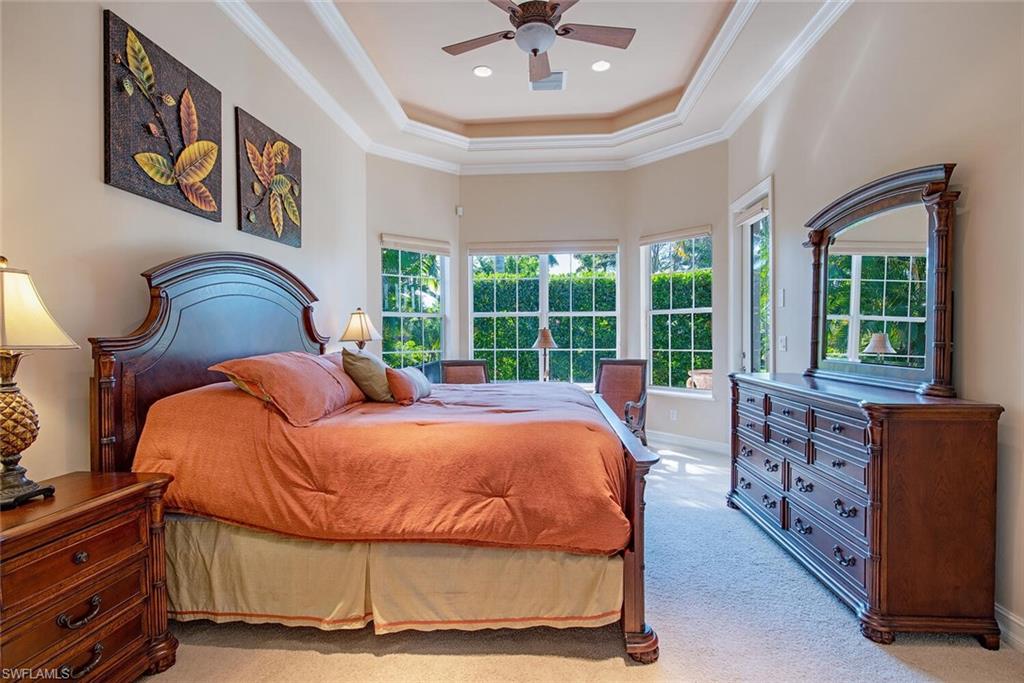 1448 Marlin Drive Naples, FL 34102 - Photo 12 of 23 a bed sitting in a bedroom next to a window