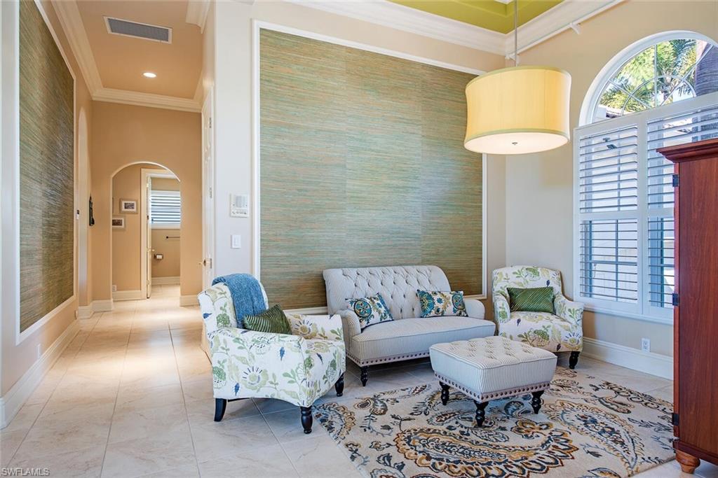 1448 Marlin Drive Naples, FL 34102 - Photo 10 of 23 a living room with furniture and a rug