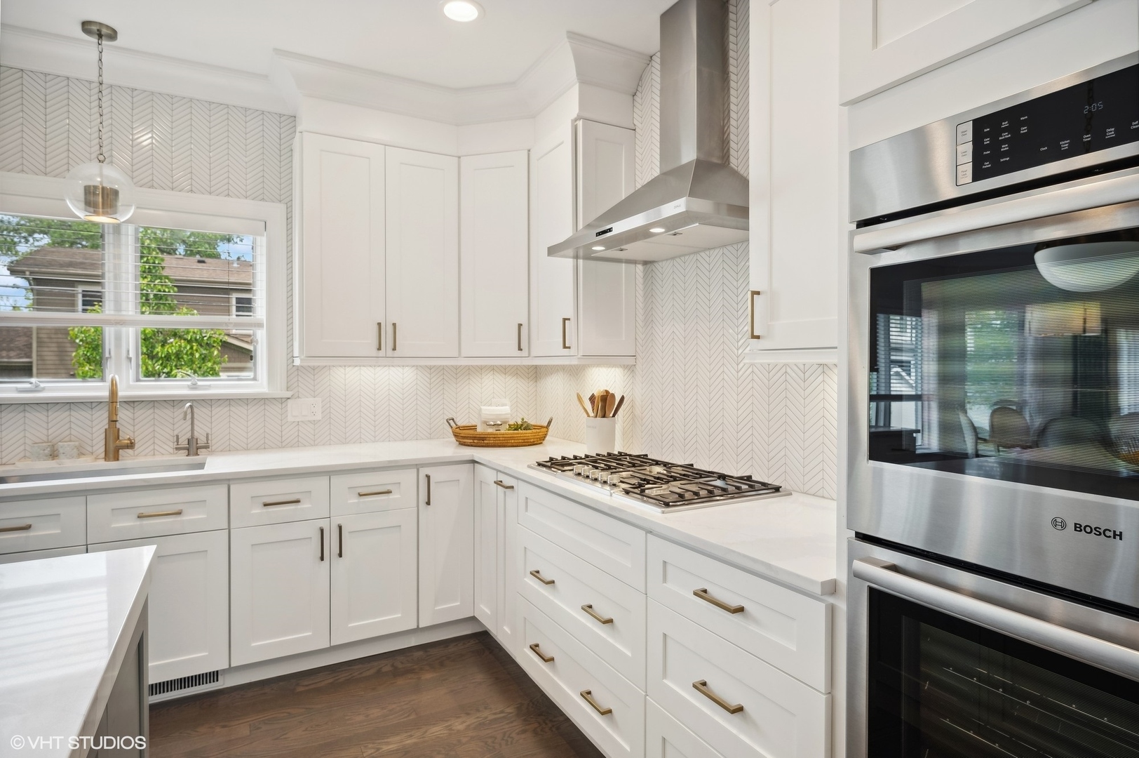 1770 Harrison Street Glenview, IL 60025 - Photo 13 of 40 a kitchen with stainless steel appliances white cabinets and a window