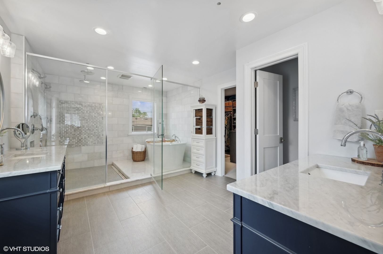 1770 Harrison Street Glenview, IL 60025 - Photo 21 of 40 a bathroom with a double vanity sink a large mirror and shower