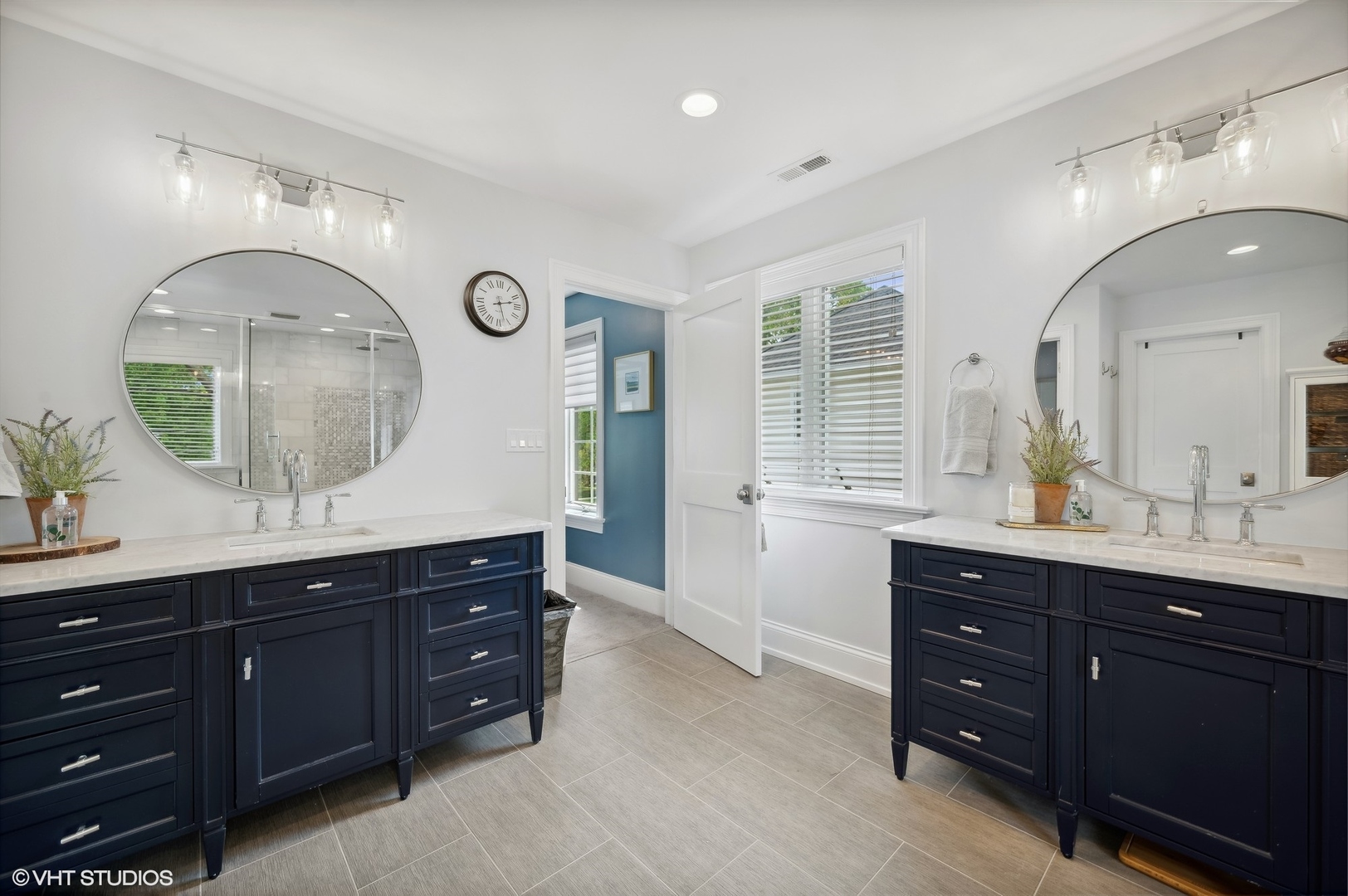 1770 Harrison Street Glenview, IL 60025 - Photo 23 of 40 a spacious bathroom with a double vanity sink and a mirror