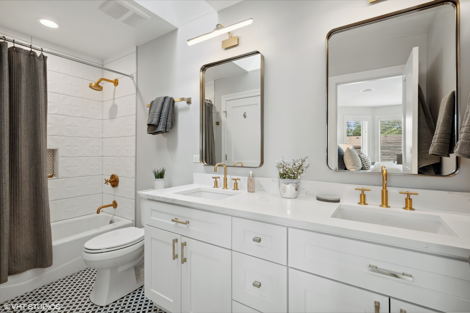 1770 Harrison Street Glenview, IL 60025 - Photo 25 of 40 a bathroom with a toilet a sink a and a mirror