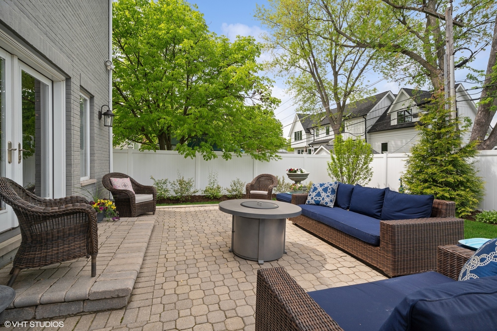 1770 Harrison Street Glenview, IL 60025 - Photo 36 of 40 a view of a patio with couches and a potted plant on a table and chairs