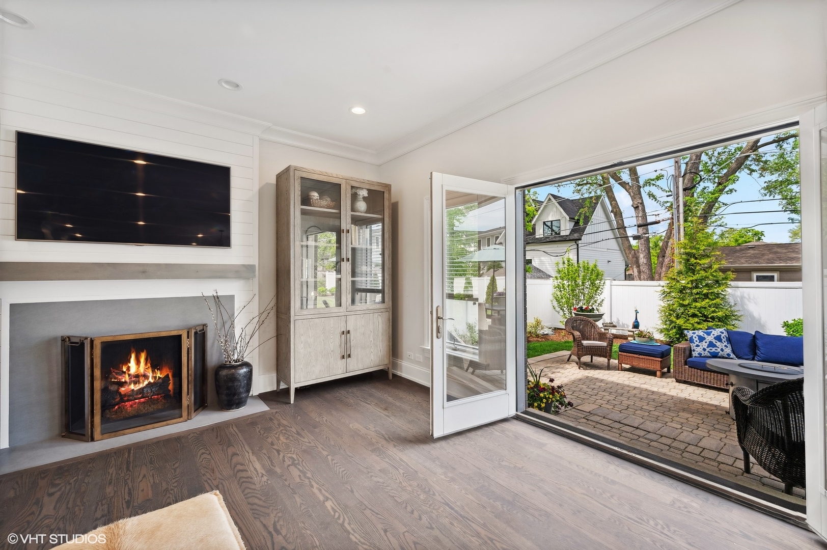 1770 Harrison Street Glenview, IL 60025 - Photo 9 of 40 a living room with furniture a fireplace and a floor to ceiling window