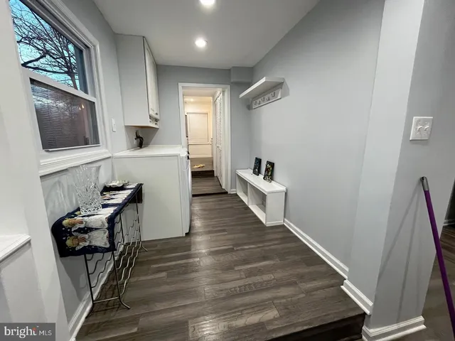 a view of kitchen with furniture and wooden floor