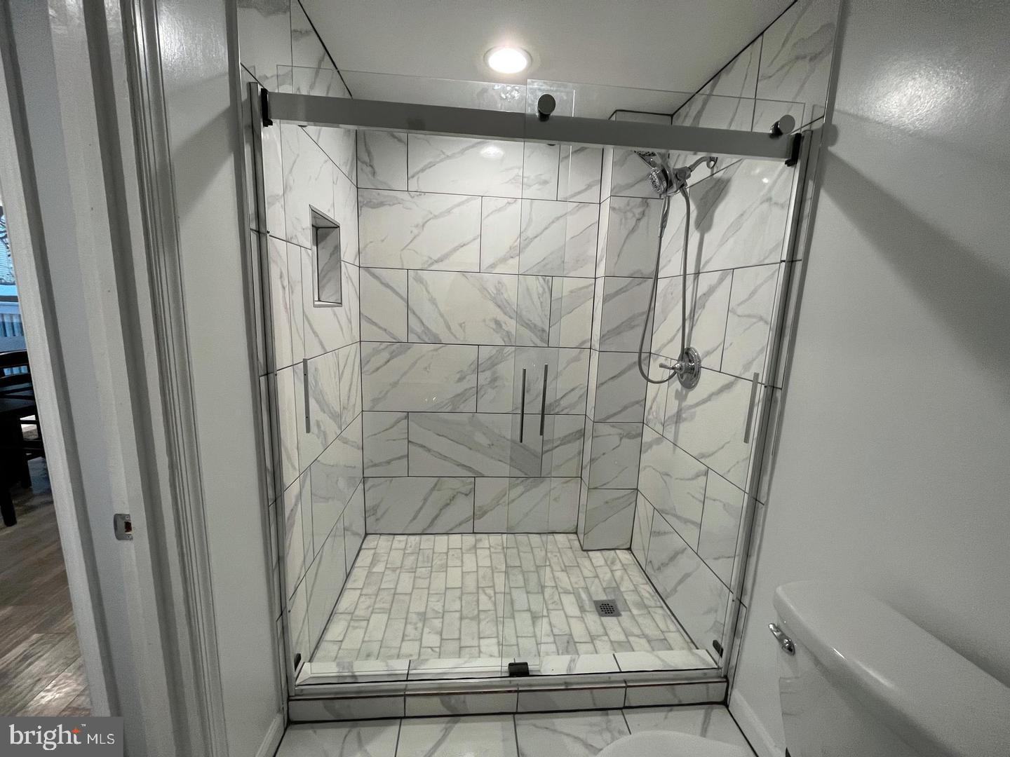 1077 South Edison Street Arlington, VA 22204 - Photo 12 of 29 a bathroom with a shower and a toilet