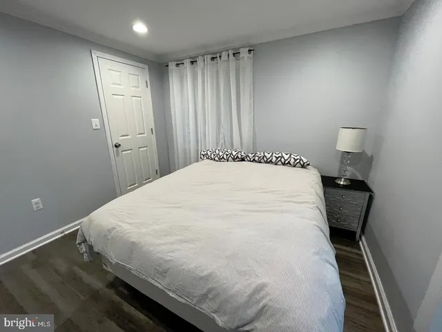 a large white bed in a small room