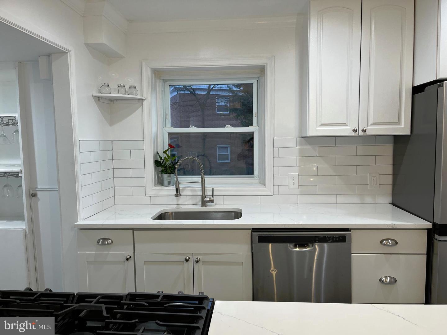 1077 South Edison Street Arlington, VA 22204 - Photo 3 of 29 a kitchen with a sink and cabinets