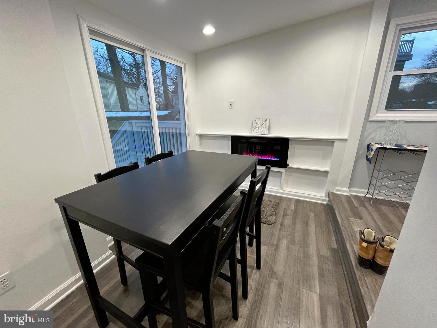 1077 South Edison Street Arlington, VA 22204 - Photo 9 of 29 a view of a dining room with furniture and wooden floor