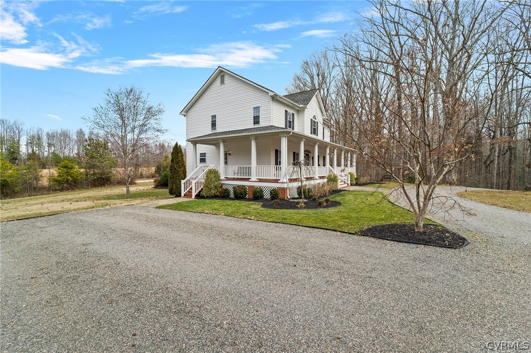 2354 Camelback Road Maidens, VA 23102 - Photo 3 of 49 a front view of a house with a yard and trees