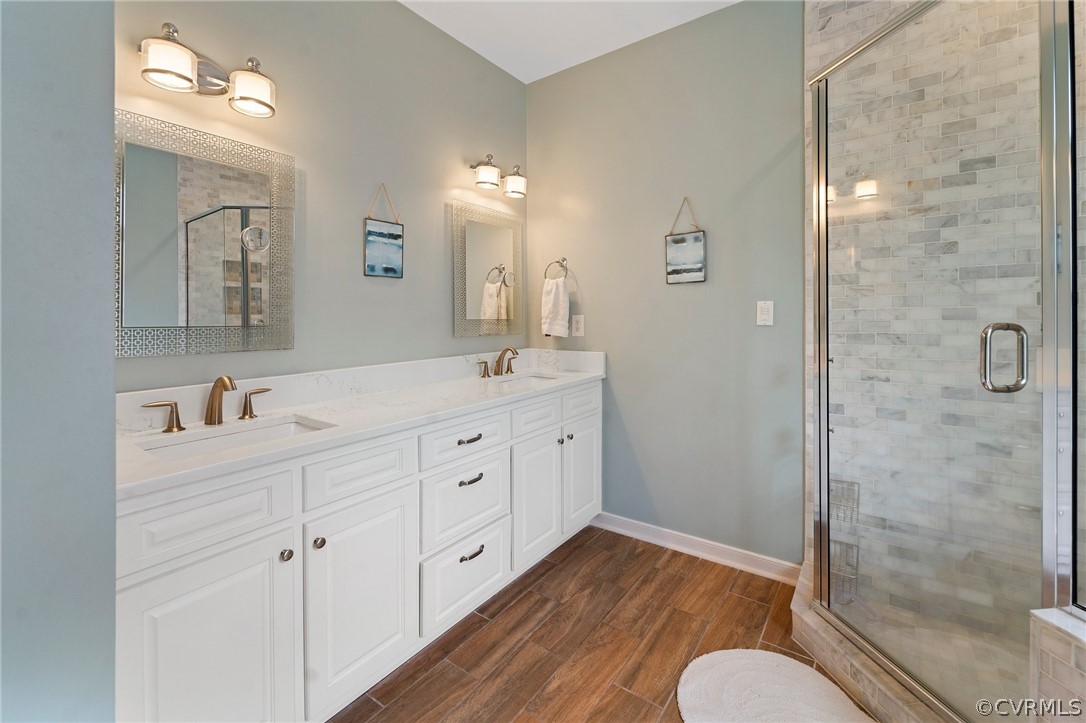 2354 Camelback Road Maidens, VA 23102 - Photo 32 of 49 a spacious bathroom with double vanity a sink a mirror a shower and vanity