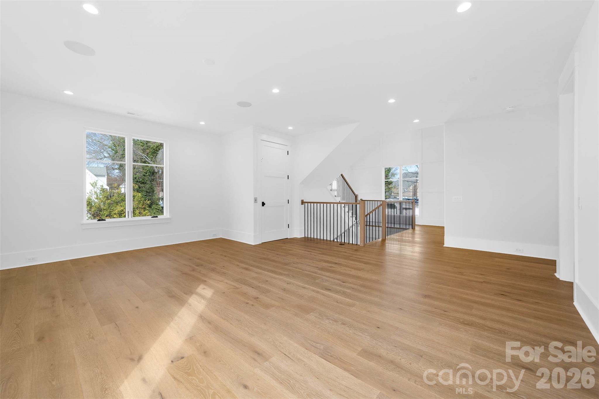 216 Walnut Street Davidson, NC 28036 - Photo 28 of 48 a view of an empty room with wooden floor and a window