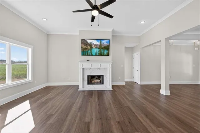a view of kitchen and hall with wooden floor and window