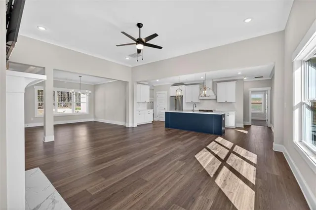 a kitchen with stainless steel appliances a refrigerator and cabinets