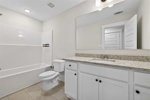 an aerial view of a house with a ocean view