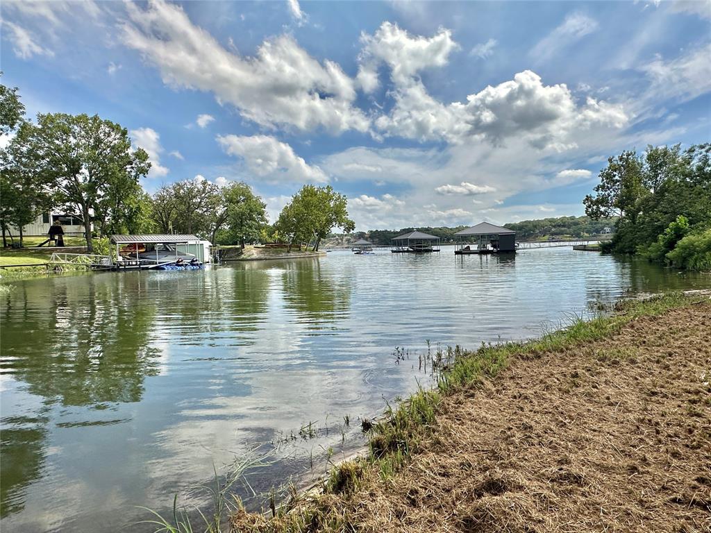 a view of a lake with houses in the back