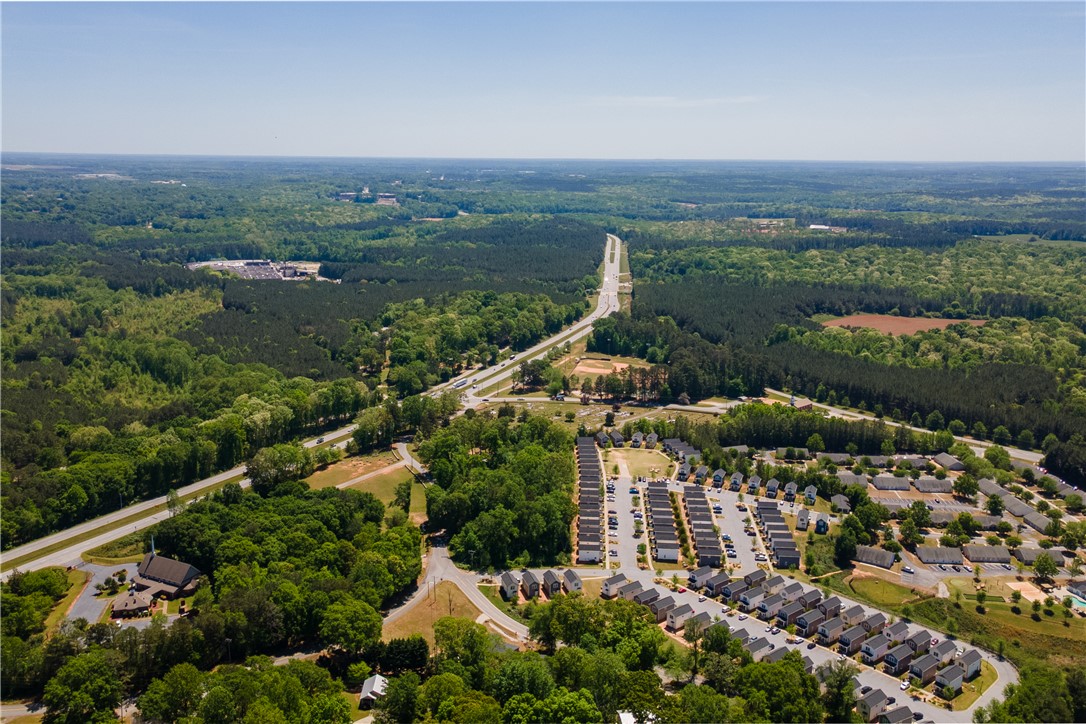 150 Ligon Street, Unit 2302 Clemson, SC 29631 - Photo 13 of 18 An aerial perspective reveals a vibrant neighborhood nestled among lush woodlands.