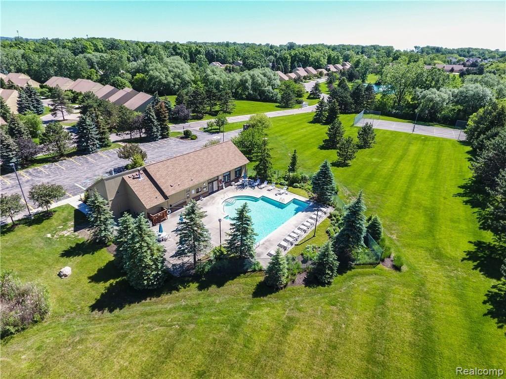 2227 Rochelle Park Drive Rochester, MI 48309 - Photo 15 of 24 Magnificent clubhouse and pool. Tennis court in background.