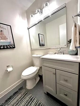 a kitchen with granite countertop a sink and cabinets