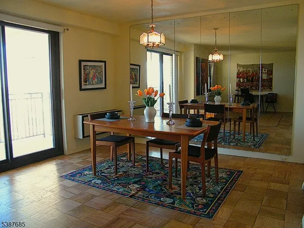 a room with gym equipment and large mirror