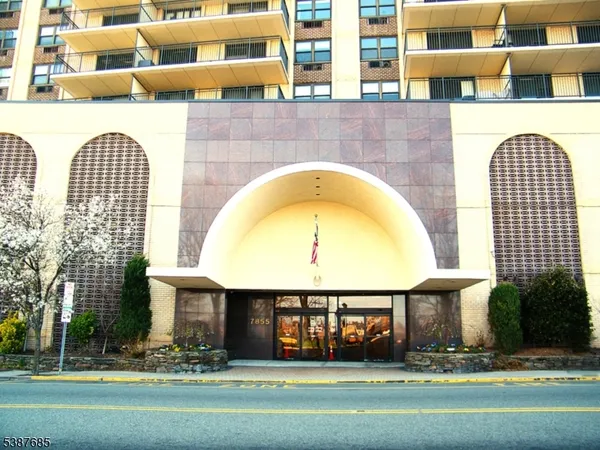 a front view of a building with garden