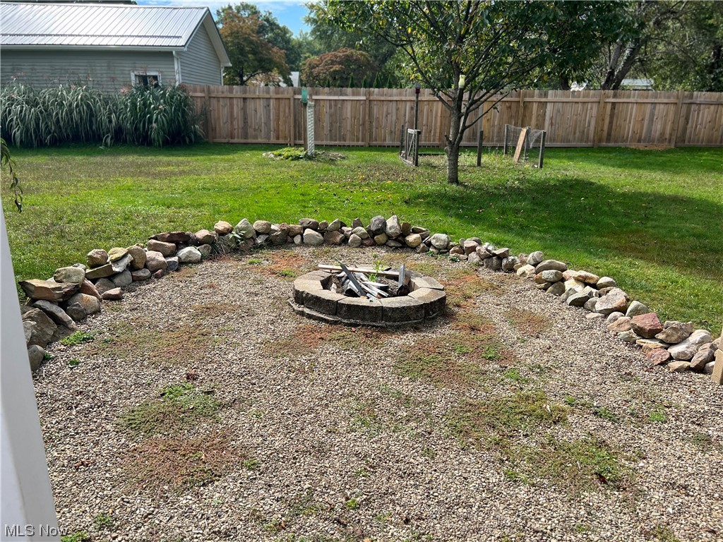 399 Furnace Road Conneaut, OH 44030 - Photo 15 of 29 View of yard featuring an outdoor firepit