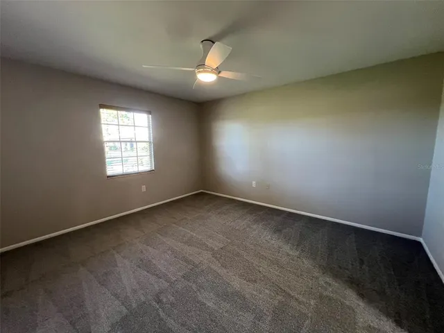 a white toilet sitting next to a bath tub