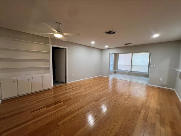 a view of a livingroom with wooden floor