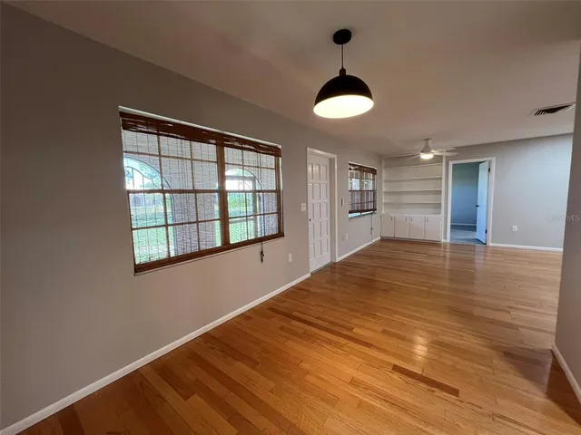 a kitchen with a sink a counter top space and cabinets