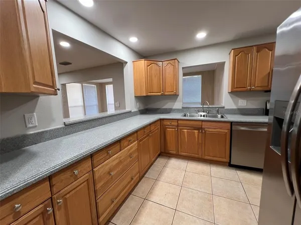 a kitchen with a sink stove and microwave