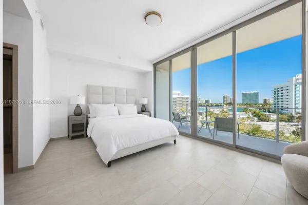a bed room with a bed and a night stand