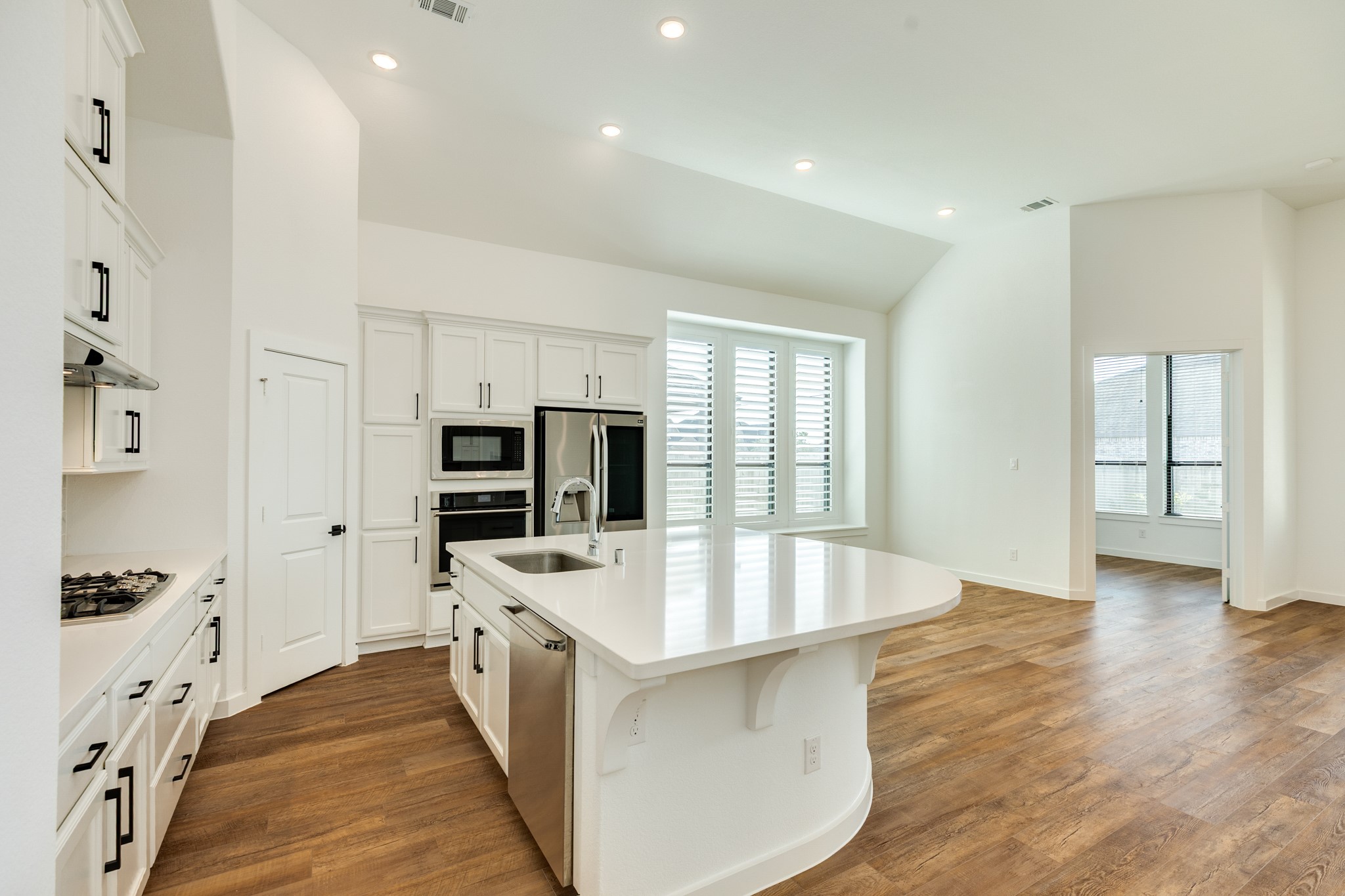 3806 Shackleton Court Rosharon, TX 77583 - Photo 16 of 50 This angle showcases the stunning floors, the dining area featuring three large windows, and to the right, the entrance to the office.