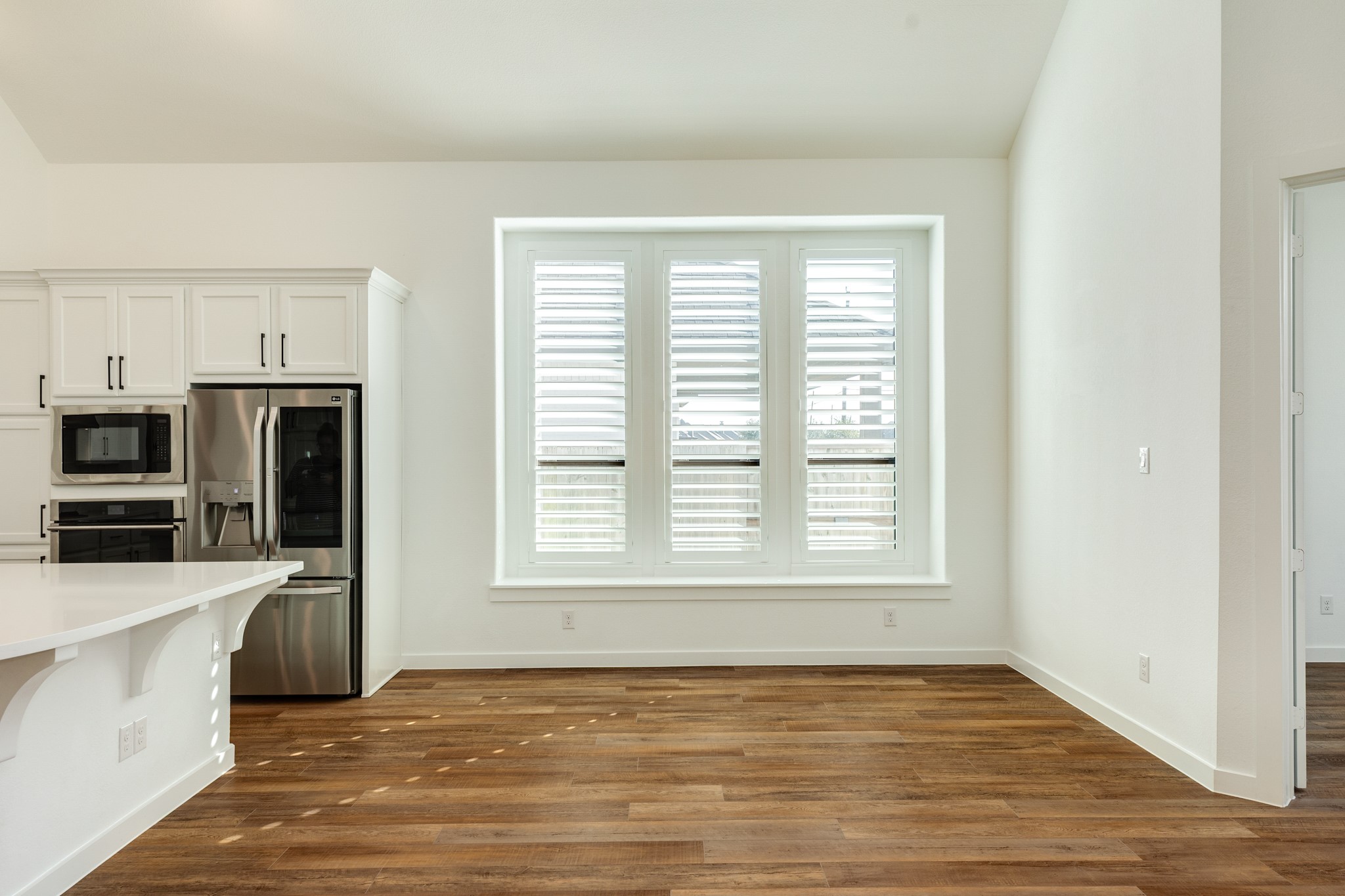 3806 Shackleton Court Rosharon, TX 77583 - Photo 47 of 50 Dining area with three windows for abundant natural light. The open floor plan is perfect for entertaining guests or hosting family gatherings.