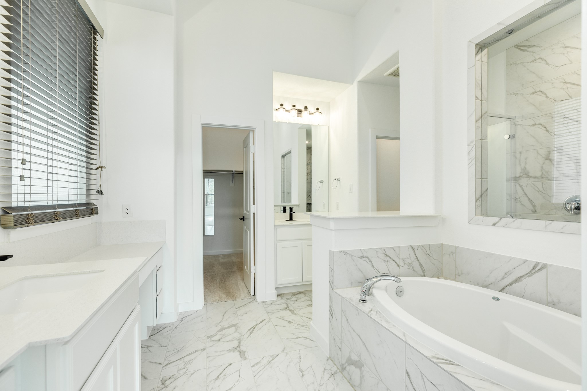 3806 Shackleton Court Rosharon, TX 77583 - Photo 26 of 50 Primary bath features quartz countertops, two vanities with a makeup/dressing area, and tile floors.