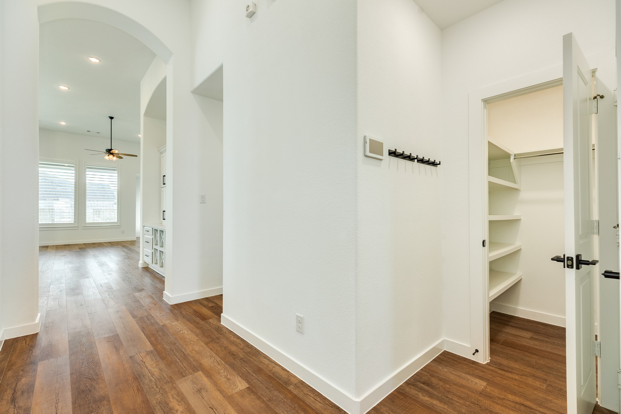 3806 Shackleton Court Rosharon, TX 77583 - Photo 10 of 50 As you continue down the hall, you'll find a coat closet on your right, with a storage area and the door to the 2-car garage nearby. The next entrance leads to the guest bedroom, bath, and laundry room area.
