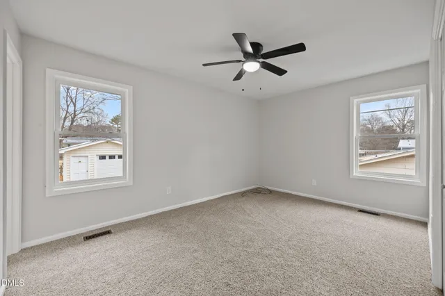 a view of cabinets with wooden floor and windows