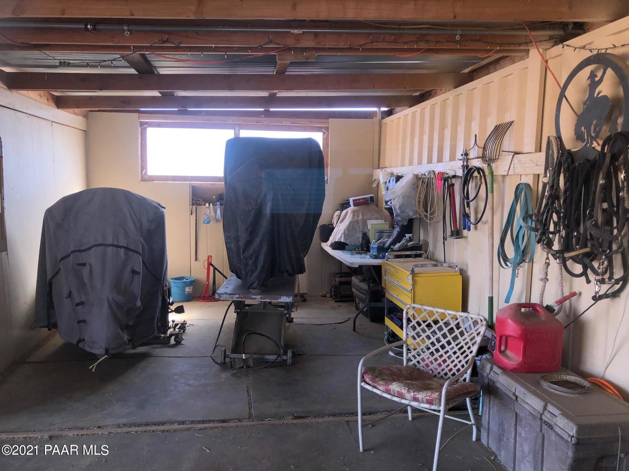 25360 North High Desert Road Paulden, AZ 86334 - Photo 11 of 16 a view of walk in closet with clothes and shoes