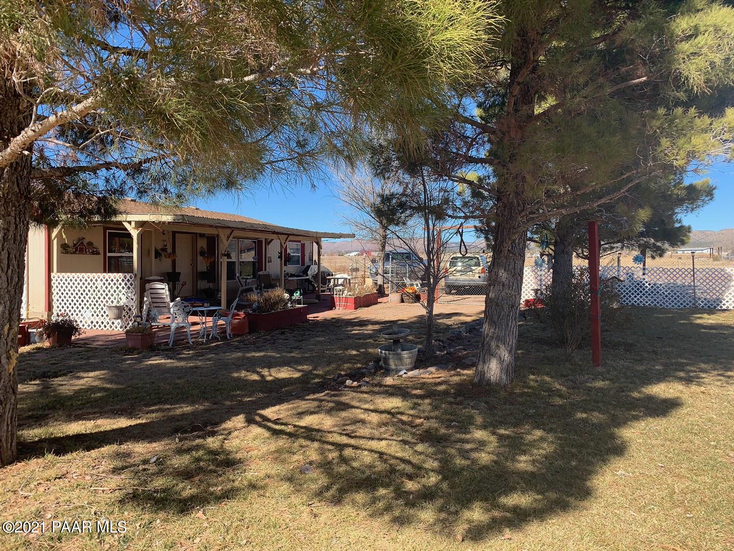 25360 North High Desert Road Paulden, AZ 86334 - Photo 3 of 16 a view of a park that has a tree on the side of the road