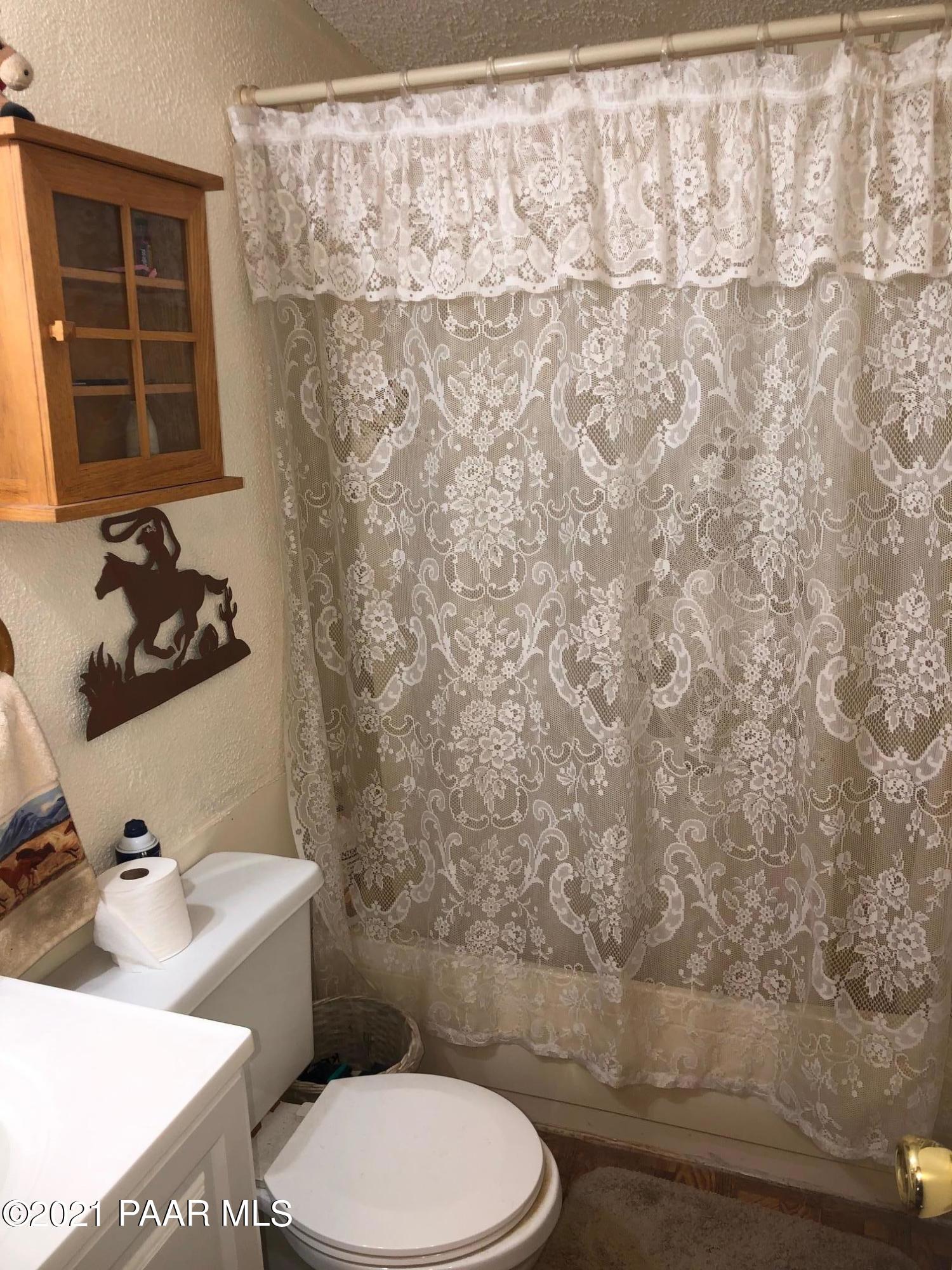 25360 North High Desert Road Paulden, AZ 86334 - Photo 5 of 16 a bathroom with a toilet and a sink